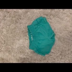 Teal swimming shorts for girls.